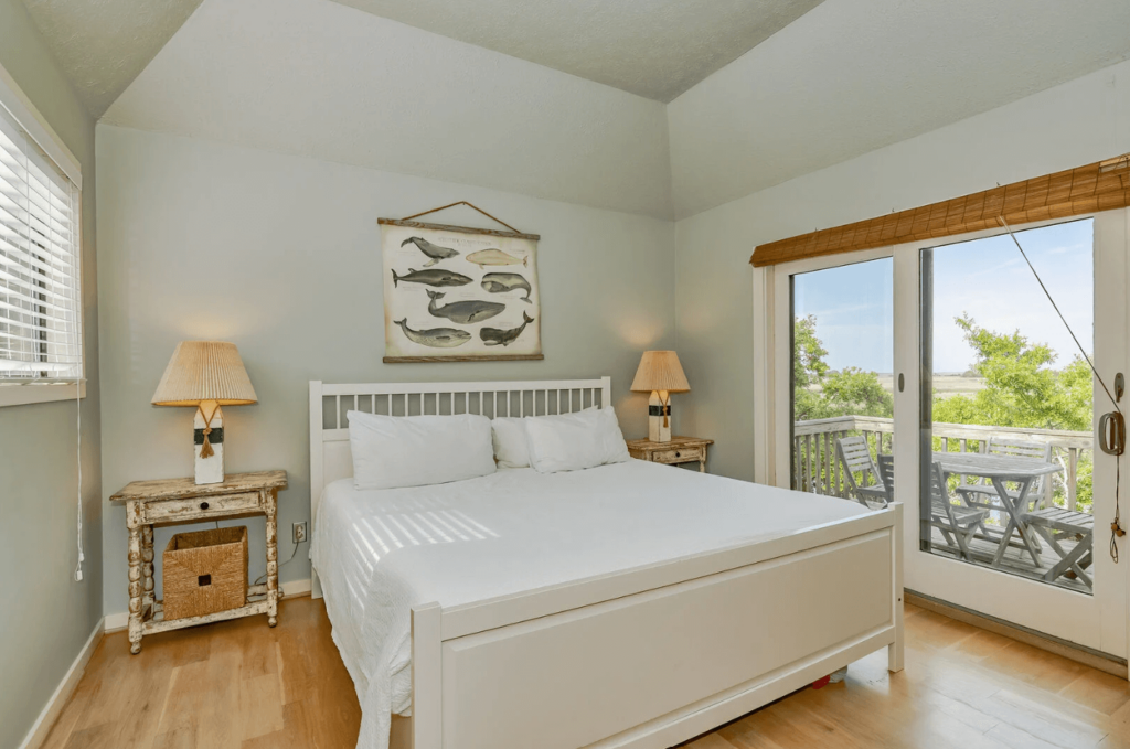 The bedroom of a Bald Head Island rental to relax in after visiting Old Baldy Lighthouse.