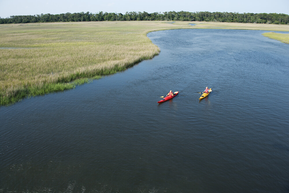 People kayaking, one of the things to do on Bald Head Island vacations.